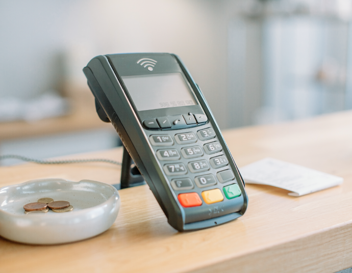 Credit card payment terminal at a small business checkout counter